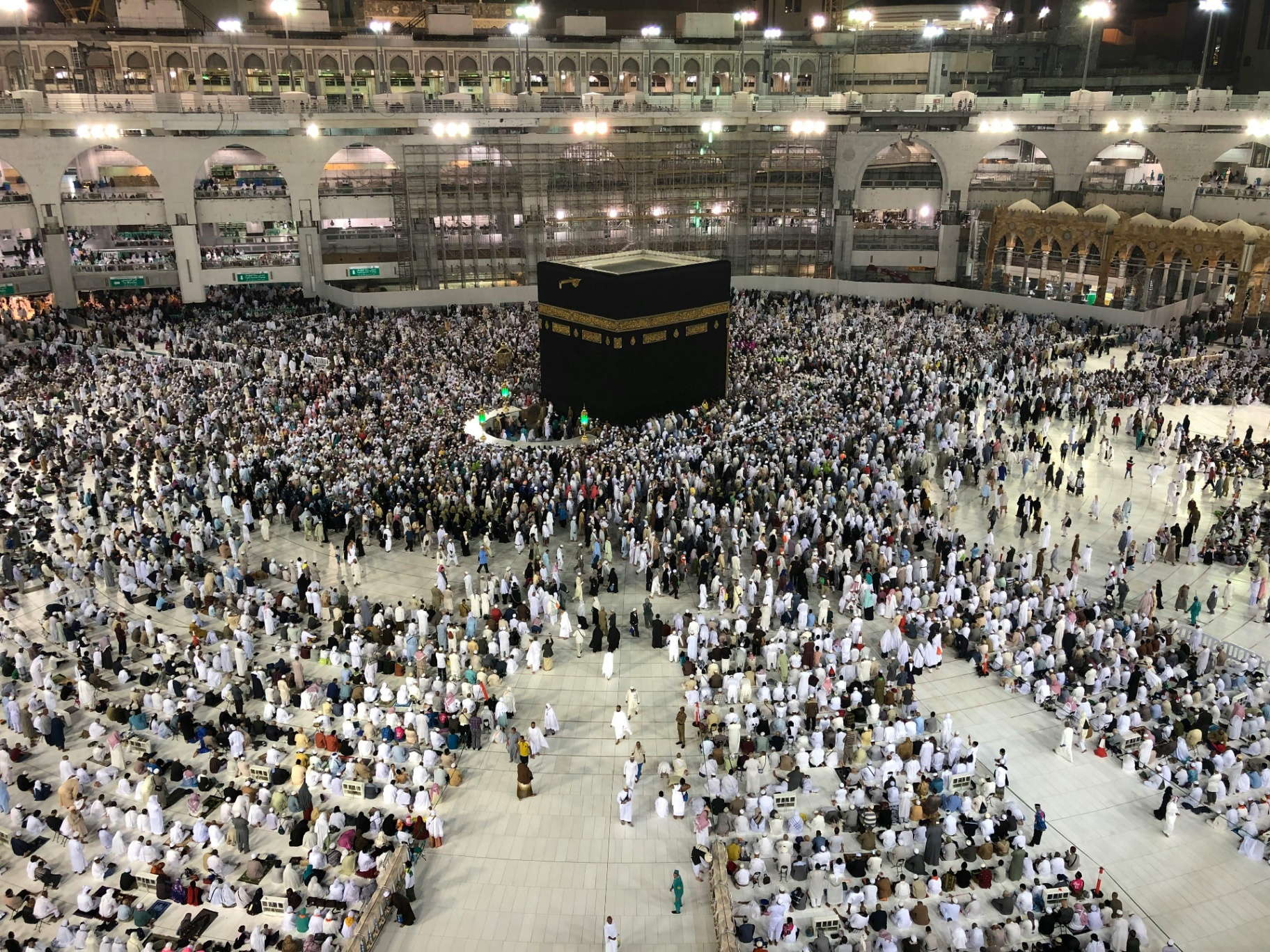 Pilgrims performing Tawaf around the Kaaba at night